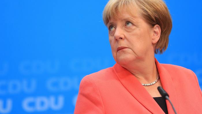 Angela Merkel, Germany's chancellor and Christian Democratic Union (CDU) party leader, looks on during a news conference following a CDU federal board meeting at the party's headquarters in Berlin, Germany, on Monday, Sept. 19, 2016. Merkel's party was dealt another blow in a regional election, posting its worst result in Berlin since the end of World War II as the anti-immigration Alternative for Germany extended its challenge to the political establishment by siphoning off voters. Photographer: Krisztian Bocsi/Bloomberg