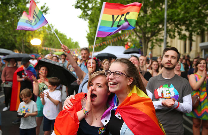 MELBOURNE, AUSTRALIA - NOVEMBER 15: Supporters of the 'Yes' vote for marriage equality celebrate at Melbourne's Result Street Party on November 15, 2017 in Melbourne, Australia. Australians have voted for marriage laws to be changed to allow same-sex marriage, with the Yes vote claiming 61.6% to to 38.4% for No vote. Despite the Yes victory, the outcome of Australian Marriage Law Postal Survey is not binding, and the process to change current laws will move to the Australian Parliament in Canberra. (Photo by Scott Barbour/Getty Images) *** BESTPIX ***