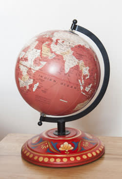 Red-coloured globe bought at a vintage fair in Europe