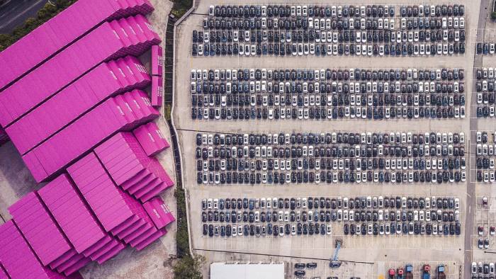 Vehicles stand at a port in this aerial photograph taken above Shanghai, China, on Monday, April 30, 2018. China won't succumb to "threats" from the U.S., a senior government official said, hours before talks are set to begin Thursday with a delegation of the Trump administration's top trade policy officials. Photographer: Qilai Shen/Bloomberg