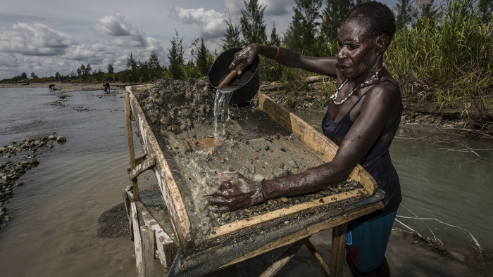 TIMIKA, PAPUA, INDONESIA - FEBRUARY 04: A illegal gold miner of Kamoro people, sift through sand and rock as they pan for gold on February 4, 2017 in Timika, Papua Province, Indonesia. Indonesia produces over 70 billion dollars in gold a year and is home to the largest gold mine and the third largest copper mine in the world, the Grasberg mine, which is located at West Papua. According to reports, the Grasberg mine, owned Freeport McMoRan, dumps as much as 200,000 tonnes of mine waste directly into the Aikwa delta system every day, turning thousands of hectares of forest and mangroves into wasteland. Indonesia continues to face various environmental problems since the gold rush and has one of the worst mercury problems from small-scale gold mining where miners usually operate without required permits. On the average, miners are able to get one gram of gold per day, which is equivalent to around 400,000 rupiah or US$30. Indigenous tribes in West Papua such as the Kamoro are still trying to make a living from fishing and foraging for food. They claim that the tailing from the gold mines have raised the riverbed, suffocating fishes, oysters and shrimps which the Kamoro people rely on for food and their livelihood. (Photo by Ulet Ifansasti/Getty Images)