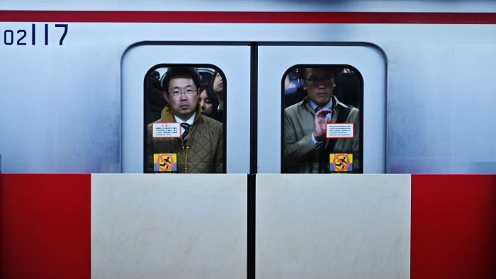 TOPSHOT - People are pictured in the metro train at the Higashi Ginza station in the Tokyo's Ginza district on April 12, 2019. (Photo by CHARLY TRIBALLEAU / AFP) (Photo credit should read CHARLY TRIBALLEAU/AFP/Getty Images)