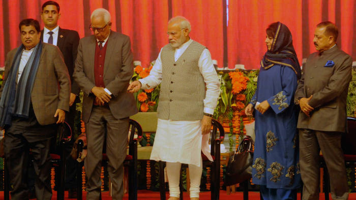 SRINAGAR, INDIA - MAY 19: Prime Minister Narendra Modi along with J&K Chief Minister Mehbooba Mufti, Governor N.N. Vohra, Union Minister Jitendra Singh and Union Minister for Road Transport and Highways Nitin Gadkari during a function to inaugurate the Kishanganga Hydroelectric Power Station in the state of Jammu and Kashmir, amid protests from neighbour Pakistan which says the project on a river flowing into Pakistan will disrupt water supplies, at Sher-i-Kashmir International Conference Centre (SKICC), on May 19, 2018 in Srinagar, India. Modi, who is on a day-long visit to the state, also flagged off the construction of the 14 km (9 mile)-long Zojila tunnel to provide all-weather connectivity between the cities of Srinagar, Kargil and Leh. (Photo by Waseem Andrabi/Hindustan Times via Getty Images)
