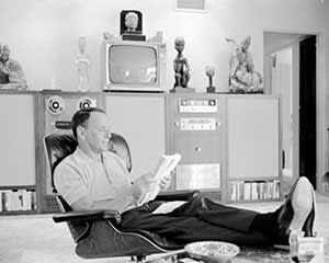 Frank Sinatra reading at home in Palm Springs, California, in 1965