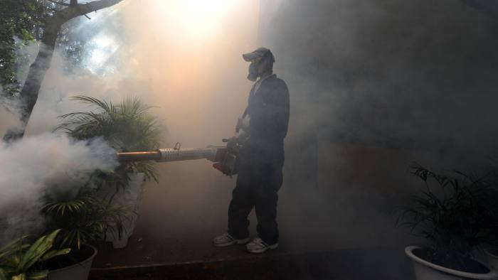 In Honduras health workers fumigate against the Aedes aegypti mosquito which carries Zika