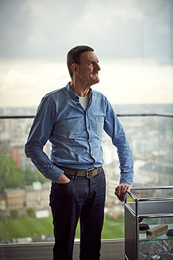 Peter Rees in his 27th-floor flat in The Heron, London