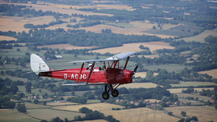 Rohit Jaggi tests a 1933 Tiger Moth above Headcorn Airfield, Kent.