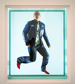 Artist, Damien Hirst, photographed in a formaldehyde tank in the White Cube Gallery, St.James, London