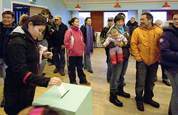 Greenlanders vote in a referendum on self-rule in November 2008