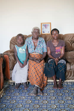 Jacqueline, the estranged 'bush wife' of Michael, with her grandmother and daughter, at the family home in Gulu
