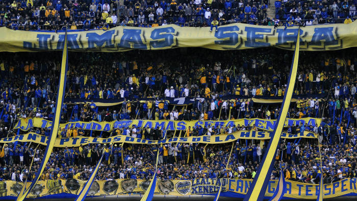 Supporters of Boca Juniors cheer during the Argentina First Division football match between Boca Juniors and River Plate at La Bombonera stadium in Buenos Aires, Argentina, on April 24, 2016.