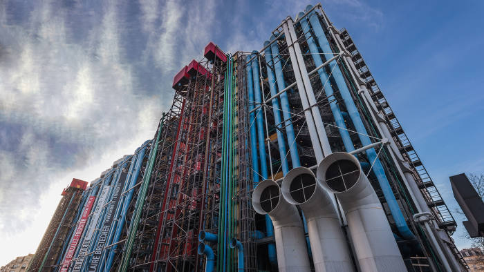 Backside entrance of Centre Georges Pompidou with cloudy blue sky in Paris, France