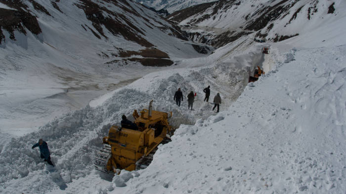 SRINAGAR, KASHMIR, INDIA - MARCH 03: Snow cutters of Indian Border Roads Organisation clearing snow from Srinagar-Leh Highway on a treacherous pass which remains snow bound for most of the time is likely to open early this year mostly because of less snowfall and dry weather on March 03, 2016 in Zojila, 108 km east of Srinagar, the summer capital of Indian administered Kashmir, India. Snow clearance begins on the 443 km long Srinagar Leh Highway and is expected to be thrown open by ending March this year as per Indian Border Roads Organisation. The highway remains snowbound for most of the time due to accumulation of snow on Zojila pass which connects Kashmir with Ladakh region a famous tourist destination among foreign tourists for its monasteries, landscapes and mountains. The average snow buildup on the rocky territory of Zojila pass normally stays in the level of 15 to 25 meters and is closed for a half of each year. It opens up in late spring and travelers on the pass have to withstand snowstorms, fierce air currents, cold and highly dangerous circumstances. (Photo by Yawar Nazir/Getty Images)