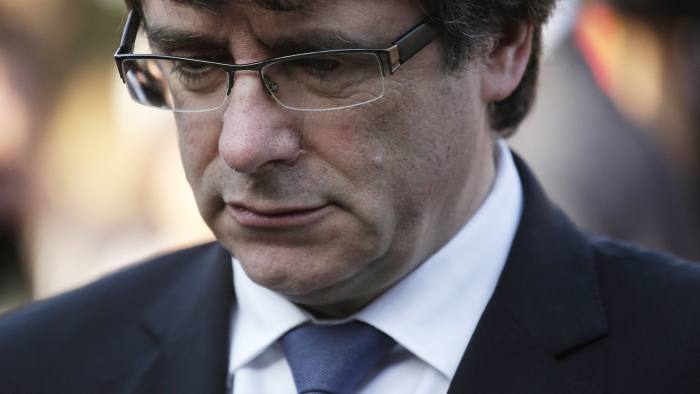 Catalan regional President Carles Puigdemont attends a ceremony commemorating the 77th anniversary of the death of Catalan leader Lluis Companys at the Montjuic Cemetery in Barcelona, Spain, Sunday, Oct. 15, 2017. Catalonia's president is facing a critical decision that could determine the course of the region's secessionist movement to break away from Spain. (AP Photo/Manu Fernandez)