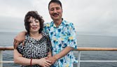 A newlywed couple at the deck of a cruise ship
