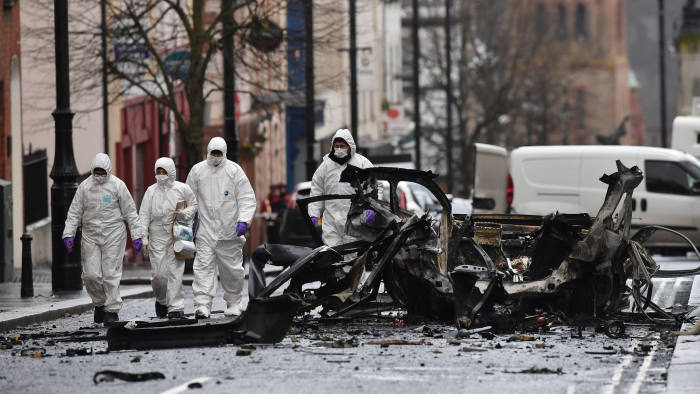 LONDONDERRY, NORTHERN IRELAND - JANUARY 20: Forensic officers inspect the remains of the van used as a car bomb on an attack outside Derry Court House on January 20, 2019 in Londonderry, Northern Ireland. Dissident republicans are suspected to have carried out the attack which has been condemned by Northern Ireland politicians. (Photo by Charles McQuillan/Getty Images)