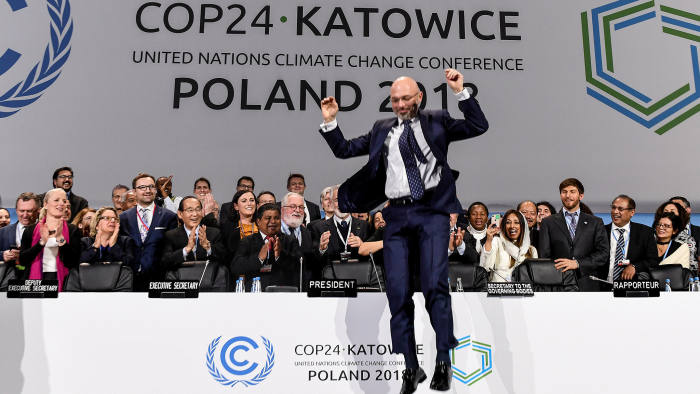 COP24 president Michal Kurtyka jumps at the end of the final session of the COP24 summit on climate change in Katowice, southern Poland, on December 15, 2018. (Photo by Janek SKARZYNSKI / AFP) (Photo credit should read JANEK SKARZYNSKI/AFP/Getty Images)