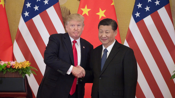 US President Donald Trump (L) shakes hands with China's President Xi Jinping during a press conference at the Great Hall of the People in Beijing on November 9, 2017. - Donald Trump urged Chinese leader Xi Jinping to work &quot;hard&quot; and act fast to help resolve the North Korean nuclear crisis, during their meeting in Beijing Thursday, warning that &quot;time is quickly running out&quot;. (Photo by Nicolas ASFOURI / AFP)