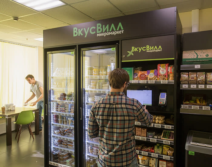 A worker uses a Vkusvill OOO self-service minimarket inside an office in Moscow, Russia, on Thursday, Nov. 21, 2019. Vkusvill, part-owned by private equity investor Michael Calvey’s Baring Vostok Capital Partners, now has more than 160 of the honor-system stations in offices housing companies such as Alibaba Group Holding Ltd., Procter & Gamble Co., Sberbank PJSC and SAP SE. Photographer: Andrey Rudakov/Bloomberg