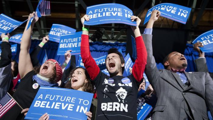 Supporters of Democratic presidential candidate Sen. Bernie Sanders, I-Vt., cheer during a primary night rally at Concord High School, Tuesday, Feb. 9, 2016, in Concord, N.H. (AP Photo/John Minchillo)