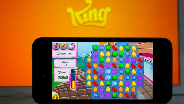 The King Digital Entertainment Plc logo and &quot;Candy Crush Saga&quot; game are displayed on an Apple Inc. iPhone 5s and iPad Air in this arranged photograph in Washington, D.C., U.S., on Tuesday, Feb. 18, 2014. King Digital Entertainment Plc, the maker of popular smartphone games including &quot;Candy Crush Saga&quot; and &quot;Pet Rescue Saga,&quot; is beginning an adventure of its own on a path to becoming a public company. Photographer: Andrew Harrer/Bloomberg