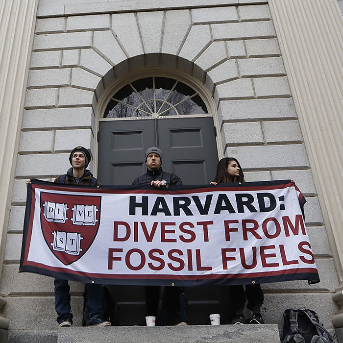 CAMBRIDGE, MA - MARCH 29: Students demanding that Harvard University divest from fossil fuels block the entrance to University Hall on the school's campus in Cambridge, MA on Mar. 28, 2017. (Photo by Keith Bedford/The Boston Globe via Getty Images)