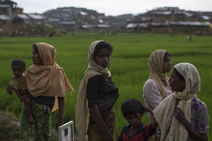 WHAIKHYANG, BANGLADESH - SEPTEMBER 10:  Rohingya refugees gather by the side of the road after arriving from Myanmar on September 10, 2017 in Whaikhyang, Bangladesh. Recent reports have suggested that around 290,000 Rohingya have now fled Myanmar after violence erupted in Rakhine state. The 'Muslim insurgents of the Arakan Rohingya Salvation Army' have issued statement that indicates that they are to observe a cease fire, and have asked the Myanmar government to reciprocate.  (Photo by Dan Kitwood/Getty Images)