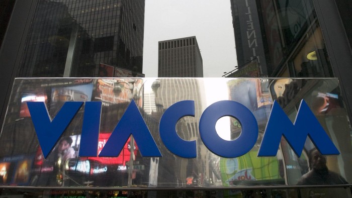 Times Square is reflected in a Viacom logo hanging outside their headquarters in New York on February 24, 2005. Photographer: Daniel Acker/Bloomberg News.