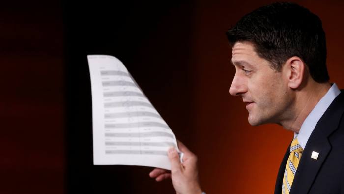 U.S. House Speaker Paul Ryan (R-WI) holds a sheet of insurance premium statistics during a news conference at the U.S. Capitol in Washington, U.S. January 5, 2017. REUTERS/Jonathan Ernst