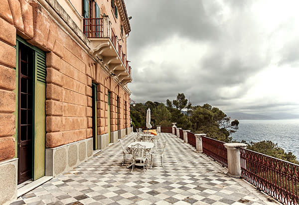 The chequered-floor terrace looks out over the Ligurian Sea