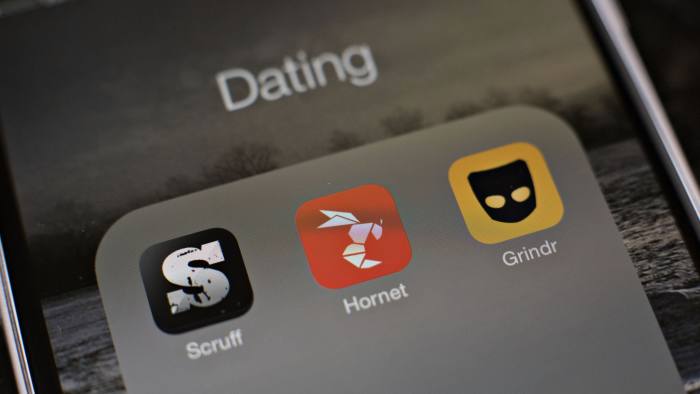 Gay dating apps Scruff, Hornet, and Grindr are displayed for a photograph on an Apple Inc. iPhone in Tiskilwa, Illinois, U.S., on Tuesday, Jan. 20, 2015. For gay men flocking to smartphone dating applications, making a connection increasingly comes with messages about HIV status, testing and drug regimens. Some apps let users declare their status, remind them to get tested and give locations of the closest clinics. Photographer: Daniel Acker/Bloomberg