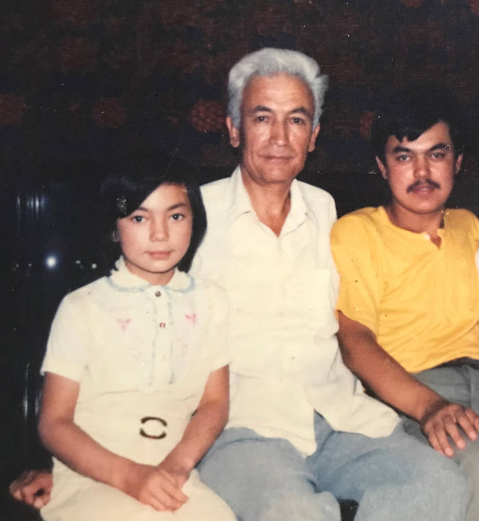 From left: Gulruy Asqar as a child, with her uncle and Husenjan Asqar, her brother, who was detained in 2018. As a translator, he had worked on several Uighur-Han Chinese dictionaries