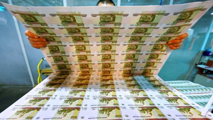 18 Dec 2014, Perm, Russia --- PERM, RUSSIA. DECEMBER 4, 2014. Uncut sheets of 100 ruble banknotes at Perm Printing Factory. Vladimir Smirnov/TASS --- Image by © Smirnov Vladimir/ITAR-TASS Photo/Corbis