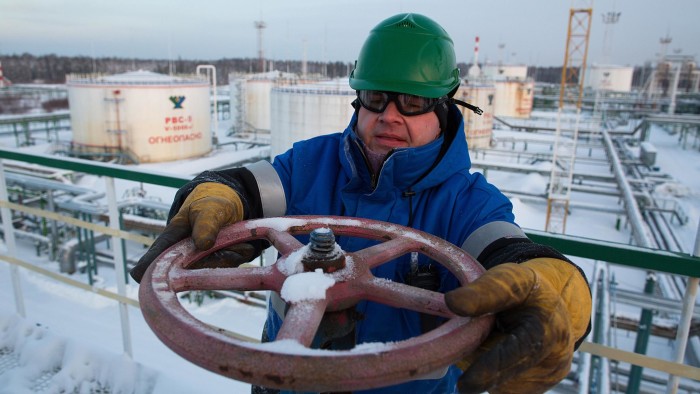 Salym Petroleum Development's Siberian Oil Fields...An employee adjusts a valve wheel at the central processing plant for oil and gas at the Salym Petroleum Development oil fields near Salym, Russia, on Tuesday, Feb. 4, 2014. Salym Petroleum Development, the venture between Shell and Gazprom Neft, has started drilling the first of five horizontal wells over the next two years that will employ multi-fracturing technology, according to a statement today. Photographer: Andrey Rudakov/Bloomberg