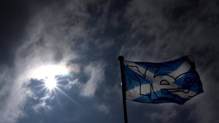A Saltire with Yes printed on it flys in Dunbar, Scotland, Tuesday, Sept. 16, 2014. The two sides in Scotland's independence debate are scrambling to convert undecided voters, with just two days to go until a referendum on separation. Anti-independence campaigners are pushing home their message that a "No" vote doesn't mean the status quo. The three main British political parties are promising Scotland greater powers, including tax-raising authority, if it remains part of the United Kingdom. The Yes campaign says the promises are vague and reveal the No side's desperation, with polls suggesting the outcome will be close. Scottish Deputy First Minister Nicola Sturgeon said "the only way to guarantee the real powers we need in Scotland is to vote Yes." (AP Photo/Scott Heppell)