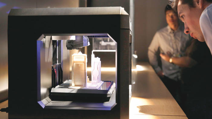 An attendee views a Makerbot Industries LLC Replicator 3D printer on display during the 2014 Consumer Electronics Show (CES) in Las Vegas, Nevada, U.S.