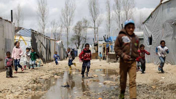 Syrian refugee children run at an informal refugee camp, at Al-Marj town in Bekaa valley, east Lebanon Lebanon, Saturday, April 8, 2017. For the millions of Syrian refugees scattered across camps and illegal settlements across the region, the chemical attack on a town in northern Syria and subsequent U.S. strike was a rare moment when the world briefly turned its attention to Syria, before turning away again.(AP Photo/Hassan Ammar)