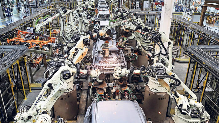 Welding machines assemble cars cockpits at the body shop station along the production line of Ford Focus at the company factory, at the Hemmaraj Eastern Seabord Industrial estate, in Pluak Daeng district, Rayong province, Thailand, on Tuesday, January 28, 2014