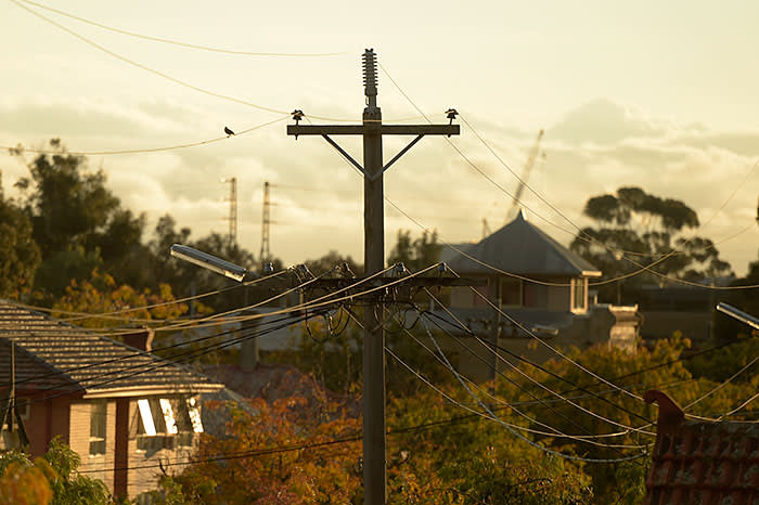 Power lines hang from a utility pole in the suburb of Northcote in Melbourne, Australia. Photographer: Carla Gottgens/Bloomberg