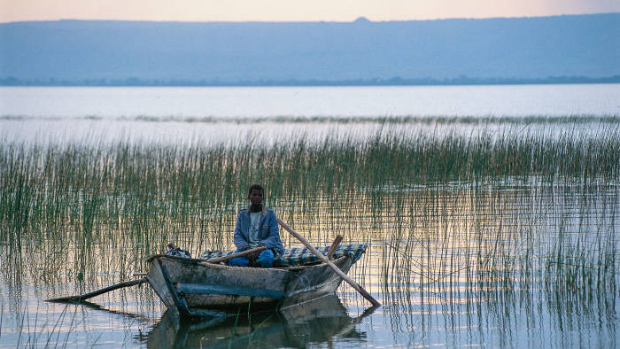 ETHIOPIA - MARCH 18: Man in a boat, Lake Awasa, Rift Valley, Ethiopia. (Photo by DeAgostini/Getty Images)