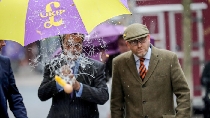 STOKE, ENGLAND - FEBRUARY 06: UKIP leader Paul Nuttall (R) and former Leader Nigel Farage MEP dodge an egg thrown by a youth as they arrive in Stoke-On-Trent for a public meeting this evening on February 6, 2017 in Stoke, England. The Stoke-On-Trent central by-election has been called after sitting Labour MP Tristram Hunt resigned from his seat to be a museum director. The seat has always been a Labour stronghold but will see fierce competition from The United Kingdom Independence Party (UKIP) as they target people who voted for Brexit and the tradtional Labour working classes. (Photo by Christopher Furlong/Getty Images)