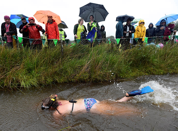 A competitor takes part in the World Bog Snorkelling Championships in Waen Rhydd peat bog at Llanwrtyd Wells in Wales, Britain August 26, 2018. REUTERS/Rebecca Naden TPX IMAGES OF THE DAY