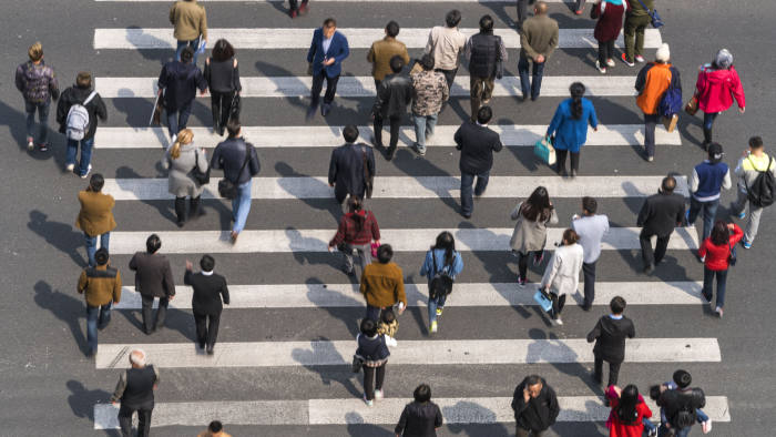 Aerial view of people on busy pedestrian crossing, Shanghai, China