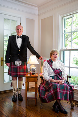 Robert Crawford, who owns one of America’s largest furniture rental firms, poses in the Crawford tartan with his wife Winnie at their Illinois home