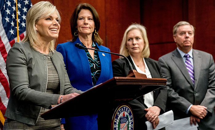 From left, former Fox News host Gretchen Carlson, accompanied by Rep. Cheri Bustos, D-Illinois., Sen. Kirsten Gillibrand, D-N.Y., and Sen. Lindsey Graham, R-S.C., speaks during a news conference where members of congress introduce legislation to curb sexual harassment in the workplace, on Capitol Hill, Wednesday, Dec. 6, 2017, in Washington. (AP Photo/Andrew Harnik)