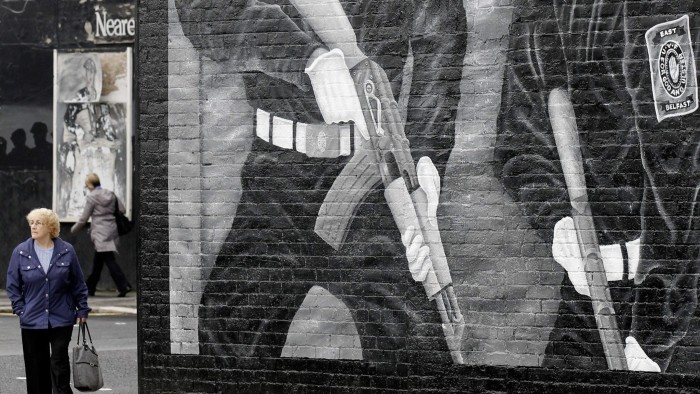 A mural showing two Ulster Voluteer Force members covers a wall on Wednesday, June 22, 2011, on the mainly Protestant Newtownards Road area of East Belfast, Northern Ireland, after overnight sectarian violence in the area. Police said about 400 people were involved in last night's unrest in the Short Strand, a small Catholic community in a predominantly Protestant area of east Belfast. Local police commanders blame members of the East Belfast UVF for the unrest. (AP Photo/Peter Morrison)