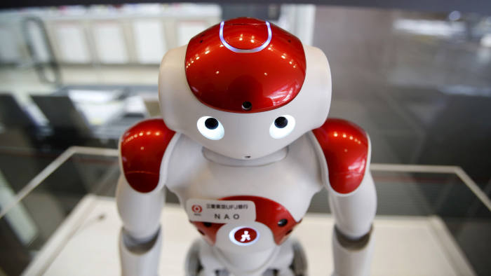 "Nao", a humanoid robot by Aldebaran Robotics that offers basic service information, is displayed in front of a branch of the Bank of Tokyo-Mitsubishi UFJ (MUFG) during a media preview at Narita International airport near Tokyo, Japan, March 25, 2016. REUTERS/Yuya Shino - GF10000359844
