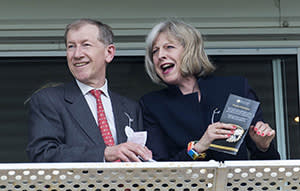Theresa May with her husband Philip cheers on Amralah to victory in the Doom Bar Stakes at the Newbury Races horse racing in Berkshire Britain, July 19 2014