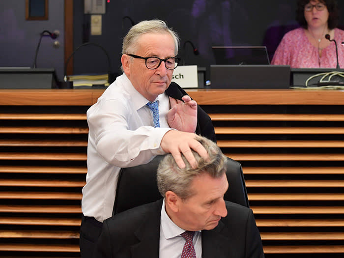 President of Commission Jean-Claude Juncker (up) ruffles the hair of EU Commissioner of Digital Economy and Society Gunther Oettinger before the College Commissioners meeting at the EU headquarters in Brussels on July 18, 2018. / AFP PHOTO / JOHN THYSJOHN THYS/AFP/Getty Images