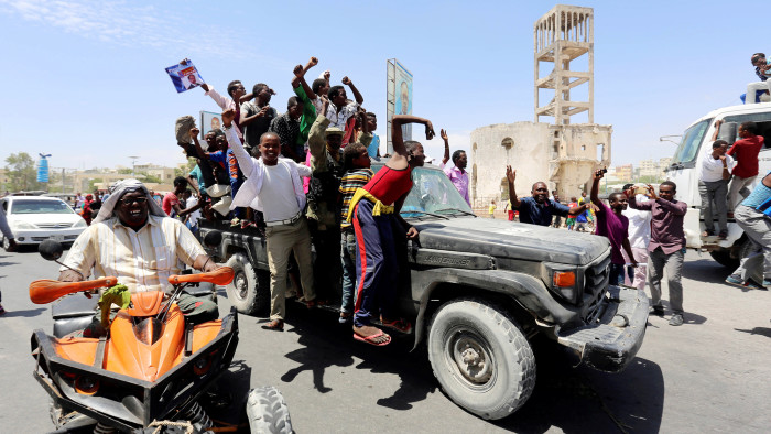 Civilians ride on a Somali police car as they celebrate the election of President Mohamed Abdullahi Mohamed in the streets of Somalia's capital Mogadishu, February 9, 2017. REUTERS/Feisal Omar